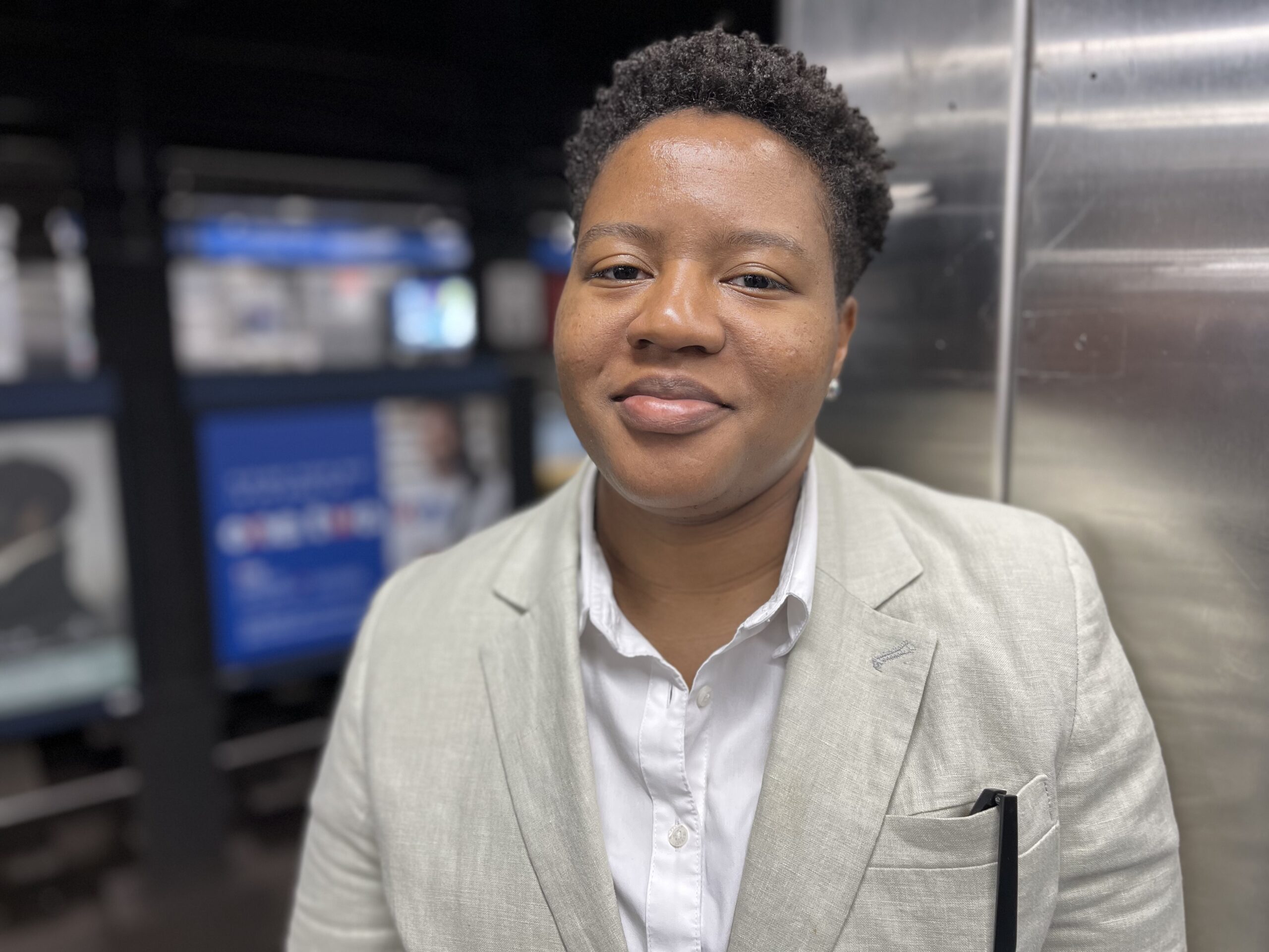 Picture of professional lawyer in a tan suit jacket